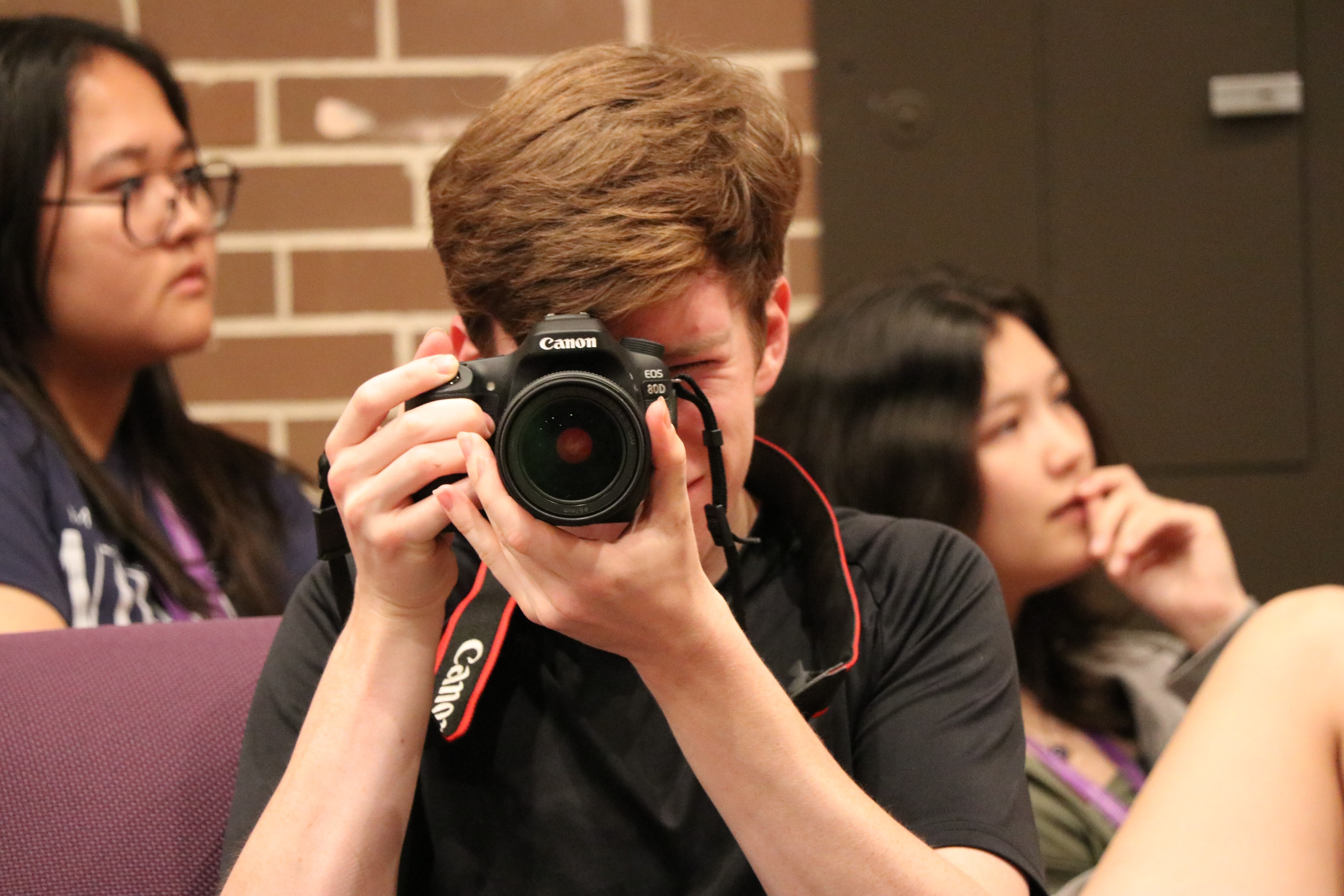 Liam Barrett photographing with a Canon camera
